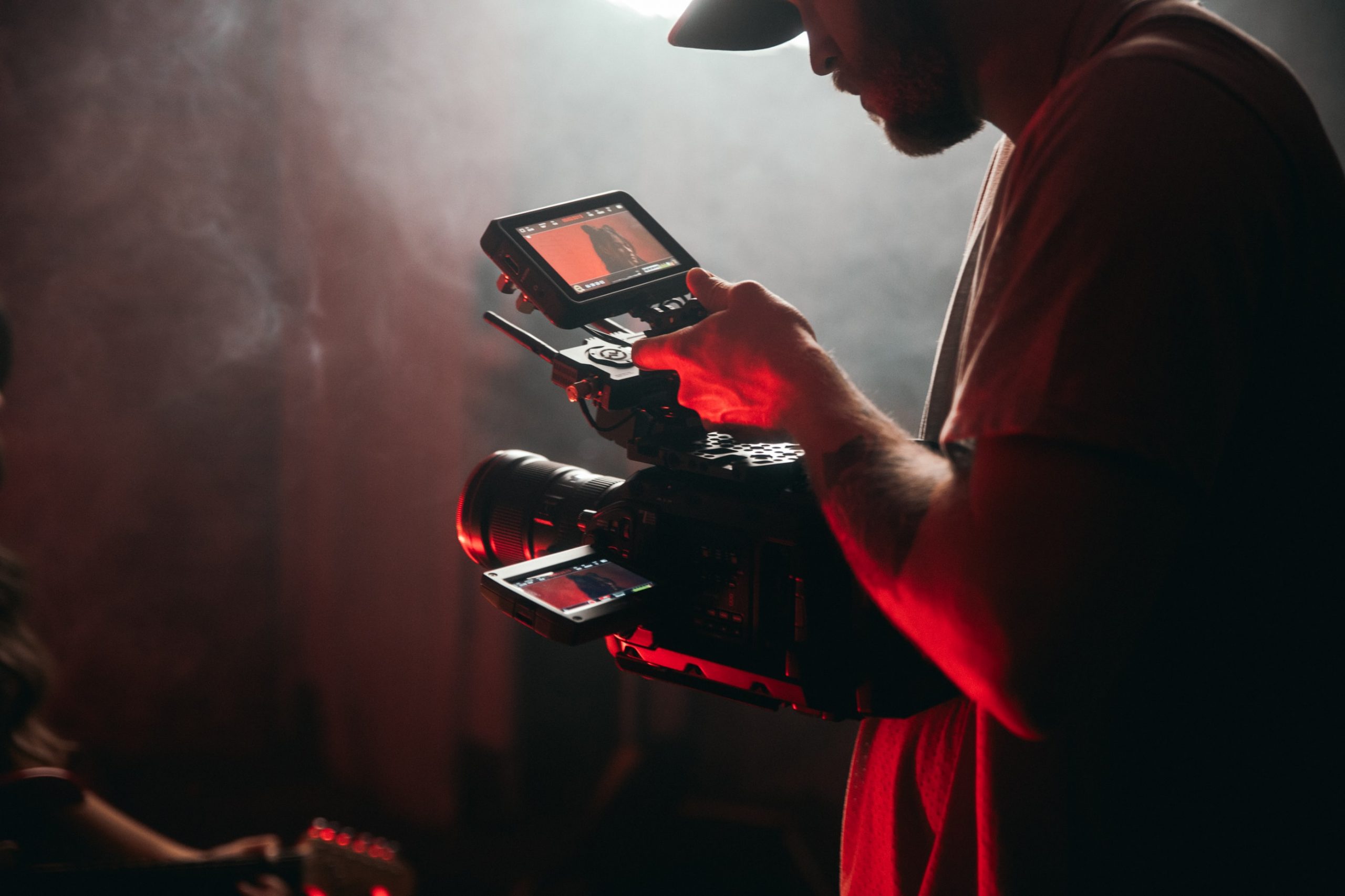 Man looking at camera monitor